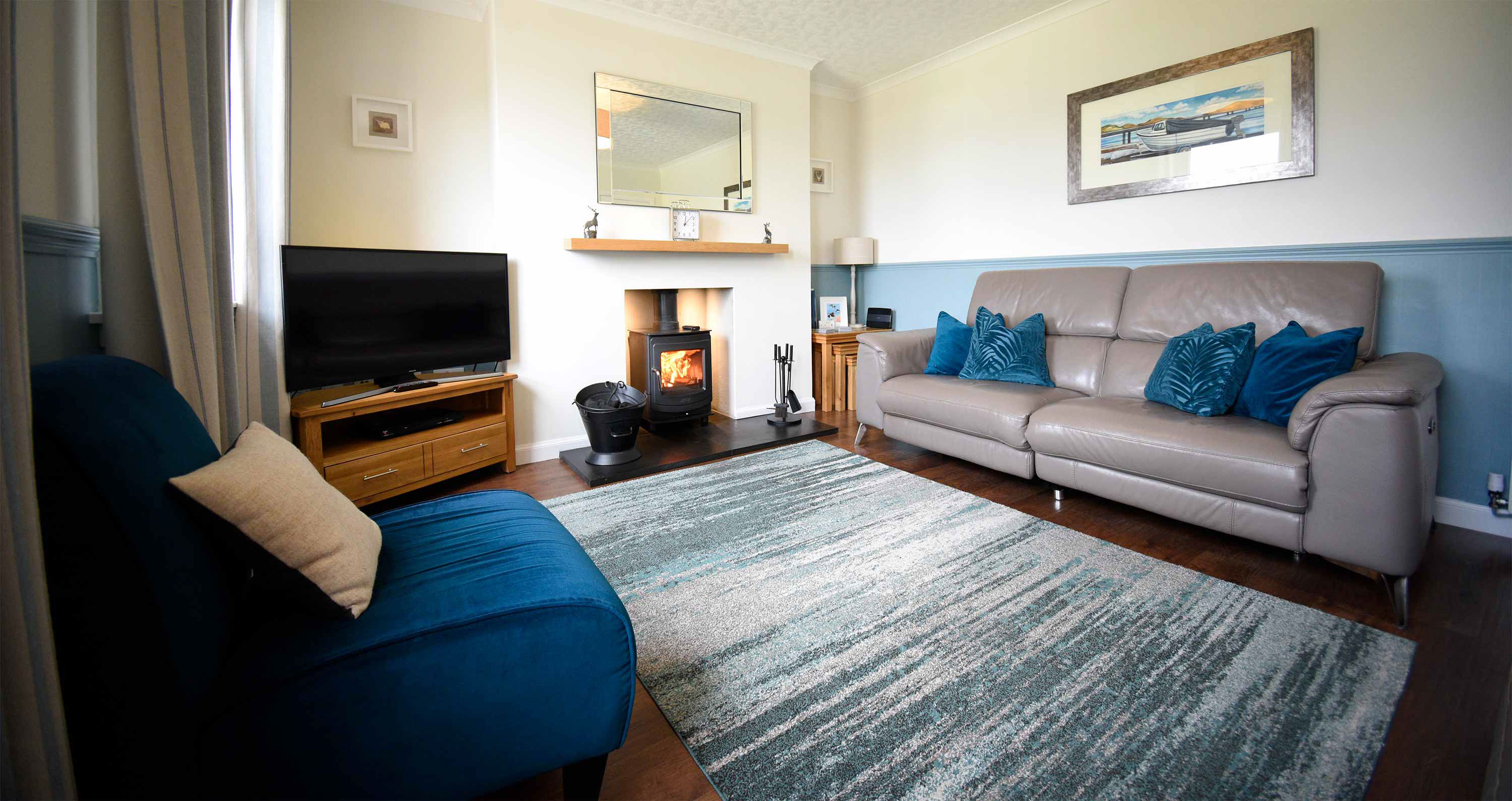 Glas Eilean View Self Catering Accommodation in Dornie living room with woodburning stove and free guest WIFI